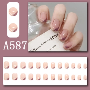 Detail of French style press-on nails with purple heart design and bridal flower motifs