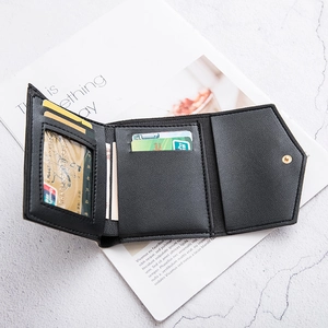 Black tri-fold mini wallet in lychee texture with card slots and gold snap button