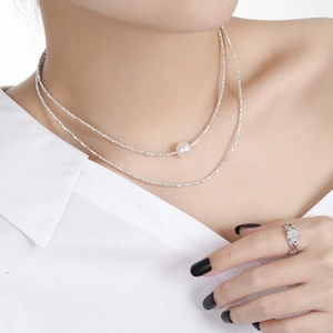 S925 sterling silver layered necklace featuring a pearl pendant and a white gem ring on model