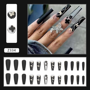 Long ballerina press-on nails in black with glitter butterfly and flower designs