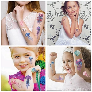 Detailed view of colorful ocean jellyfish temporary tattoos on a child's arm for parties