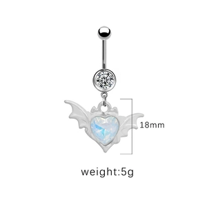 Macro shot showing 18mm bat wing and heart gemstone pendant navel ring details