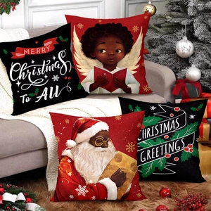 Christmas pillow covers with Santa patterns on a sofa with holiday decorations
