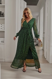Detailed view of dark green metallic V-neck dress with high slit and shimmering texture