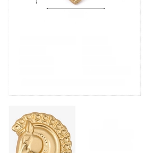 Detailed view of baroque golden horse head brooch with engraved textures, width 3.5cm