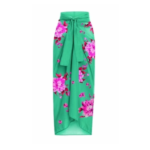 Detail view of long wrap skirt with green floral print and waist tie for summer beachwear