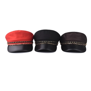 Three Baker Boy hats in red, black and brown with star studs and gold chain decor