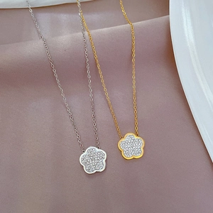 Titanium steel flower necklace with sparkling crystals in gold and silver finishes