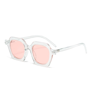 Retro geometric hexagonal sunglasses with transparent frames and light pink lenses