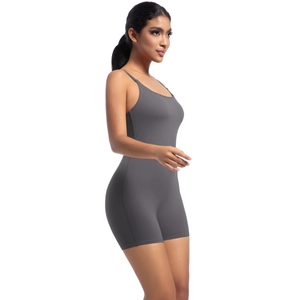 Side view of dark gray seamless yoga bodysuit with spaghetti straps and slim fit design