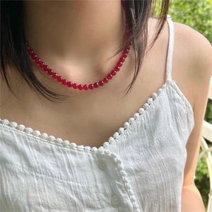 Elegant 925 sterling silver necklace with red agate beads shown on a model neck