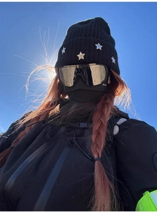 Outdoor winter sports set featuring a black knit beanie, ski goggles, and a protective mask