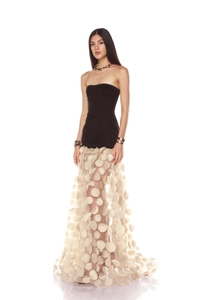 Detail of white mesh skirt featuring 3D circular appliques and premium texture