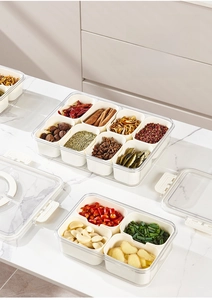 Macro detail of transparent spice storage box with nine removable compartments and seal lid