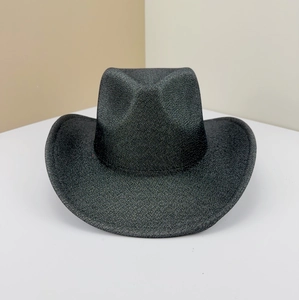 Macro view of black glitter cowboy hat featuring a curved brim and pinched crown detail