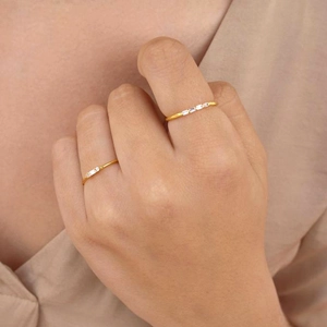 Set of two minimalist 18k gold plated copper rings featuring rectangular white zircon stones
