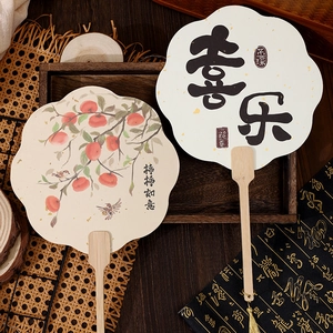 Traditional Chinese silk hand fans with bamboo handles, tassels, and persimmon patterns
