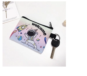 Detail view of alpaca coin purse with astronaut print, canvas fabric and metal zipper
