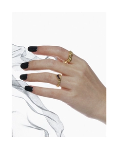 Irregular textured gold S925 silver rings with micro-set dark zircons on model hand