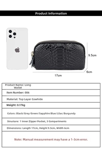 Detail view of leather clutch wallet showing crocodile texture and size dimensions