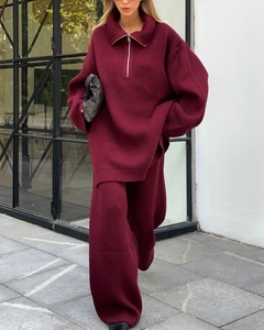 Detail of burgundy oversized knit set showing vertical ribbed texture and half-zip collar