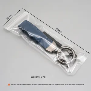 Detail of dark blue suede keychain with gunmetal hardware and 178mm length dimensions