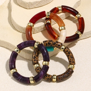 Detail of vintage acrylic stretch bracelets with leopard print and marble patterns