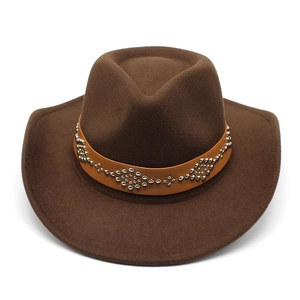 Detail of dark brown wool cowboy hat featuring a leather band with silver floral rivets