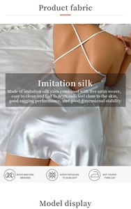 Detail of silver silk satin nightgown showing the crisscross back straps and fabric texture