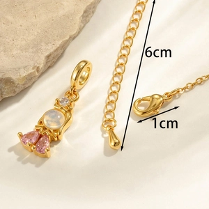 Gold mermaid pendant necklace with pink zircon and moonstone showing size details