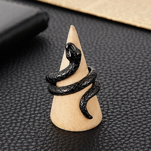 Retro punk style stainless steel cobra snake ring for men on a wooden display stand
