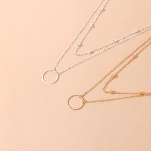 Minimalist double-layered chain necklace with small beads and round pendant in gold and silver