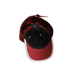 Internal view of burgundy kids baseball cap with King lettering and white brim piping