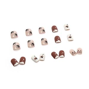 Cute cat paw press-on nail set with cream and brown color-blocking patterns