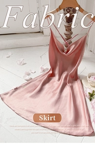 Detail of pink satin slip dress with cowl neck and elegant criss-cross back straps