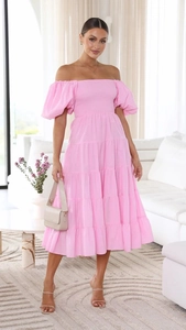 Detail of pink off-shoulder tiered midi dress with puff sleeves and elastic waist