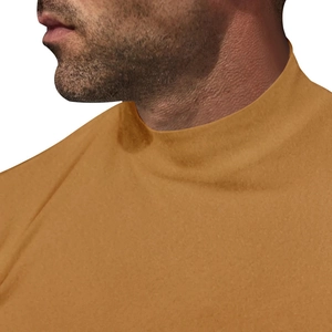 Detail shot of men's turtleneck thermal base layer in ginger yellow knit fabric