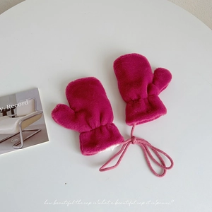 Detail of rose red plush toddler mittens with soft faux fur texture and anti-lost string