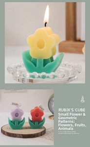 Close-up of colorful tulip shaped scented candles on a wooden base in ins style