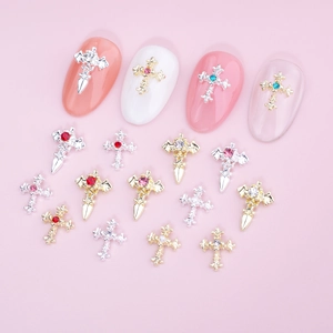 Cross and dagger nail art charms with colorful rhinestones in gold and silver