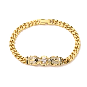 Macro detail of gold plated cuban link bracelet featuring dual leopard heads with zircons
