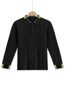Detailed close-up of long sleeve black polo shirt with striped collar and cuffs