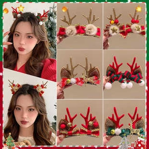 Close-up of assorted Christmas antler hair clips with bells and festive bowknot details