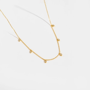 Close-up of S925 silver gold necklace with six marquise-cut clear zircon pendants