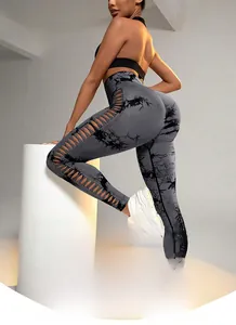Detailed close-up of grey tie-dye seamless yoga pants featuring side lace-up cut-outs