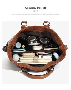 Detail view of large brown tote bag interior showing multiple spacious compartments