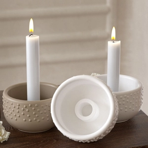 Close-up of dot-textured silicone resin mold for candle holders with slot detail