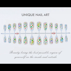 Close-up of colorful polka dot press-on nails almond shape on production rack