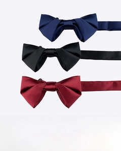 Flat lay of navy, black, and wine red satin bow ties with adjustable neck straps
