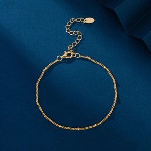 Elegant S925 sterling silver gold beaded bracelet on a premium navy textured background